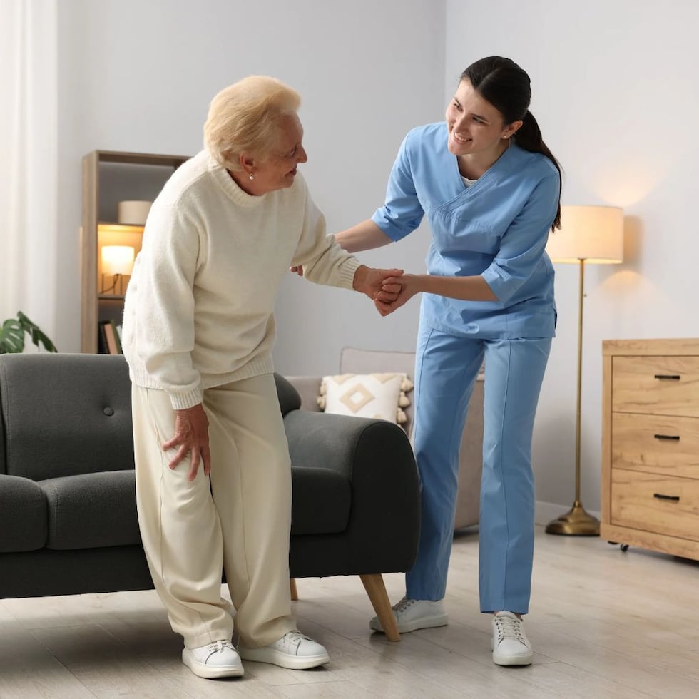 Nurse helping old lady