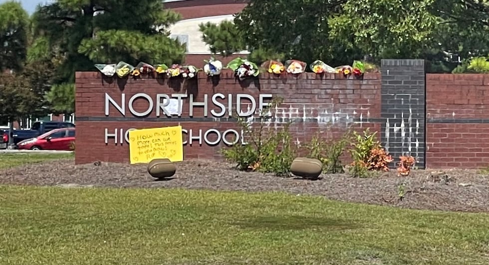 A memorial of flowers continues to grow outside of Northside a day after a student was stabbed...