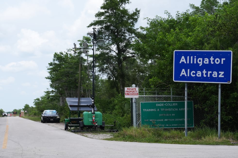 A Florida Highway Patrol car guards the entrance to the "Alligator Alcatraz" detention center...