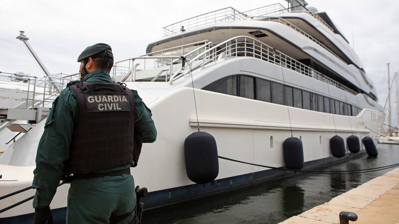 A Civil Guard stands by the yacht called Tango in Palma de Mallorca, Spain, Monday April 4,...