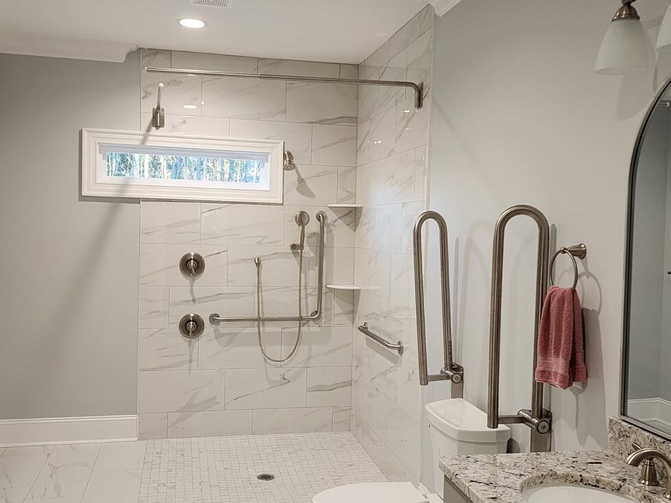Mobility Plus | Accessible talk in shower with grab handles.