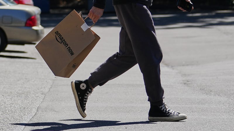 A driver picks up an order at an Amazon Now location, Monday, May 11, 2026, in Bellevue, Wash.