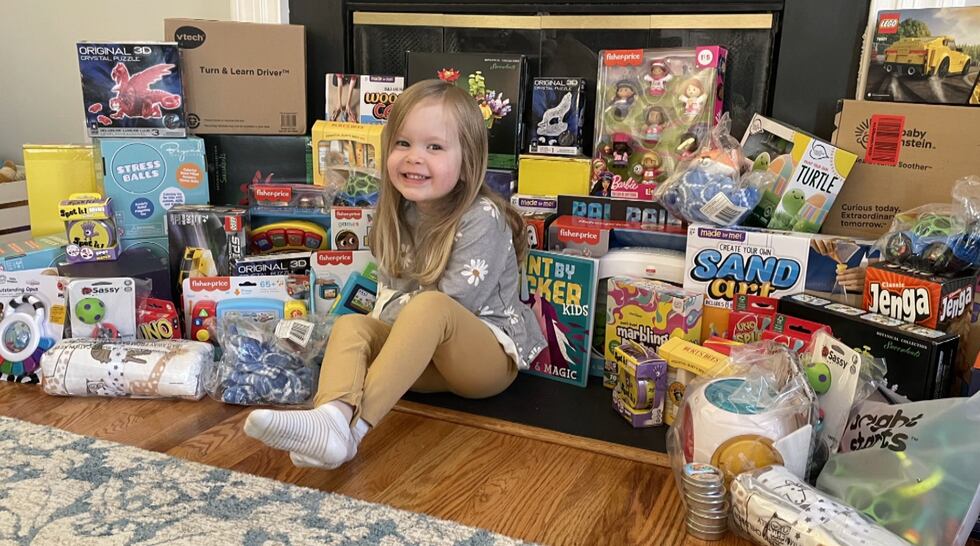 With help, Amelia Browell was able to fill the front of her fireplace with dozens of items on...