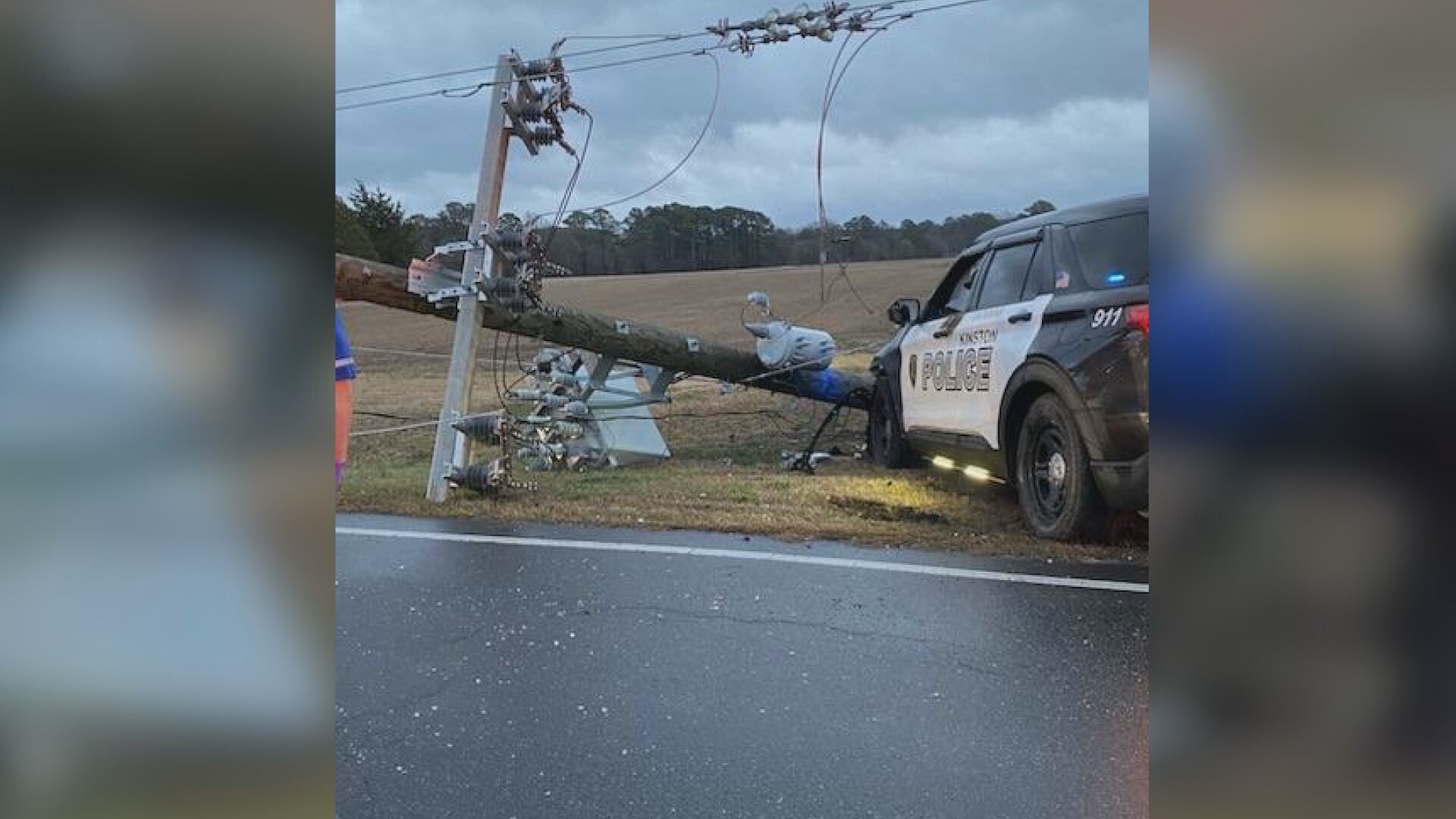 Fire crews help officer trapped in Kinston police car after crashing into light pole