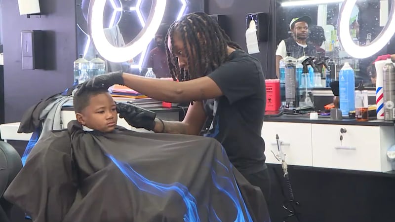Greenville barbershop gives out free haircuts and school supplies for back-to-school