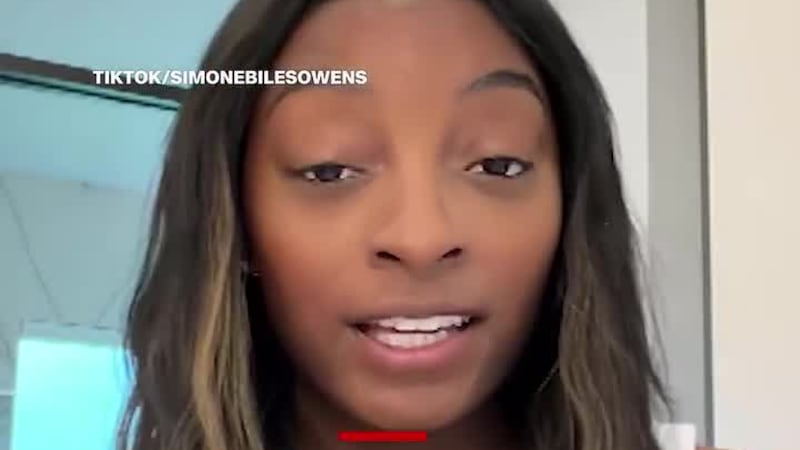 Simone Biles said her six-figure Porsche was stolen from her home in Chicago. (CNN, Getty...